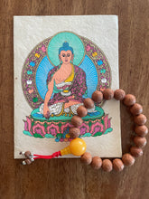 Retrato de Buddha con mala de pulsera